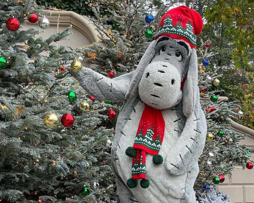 Eeyore Meets Park Goers in his Cute Winter Outfit Near Central Plaza During Disney's Enchanted Christmas Season, Disneyland Paris.