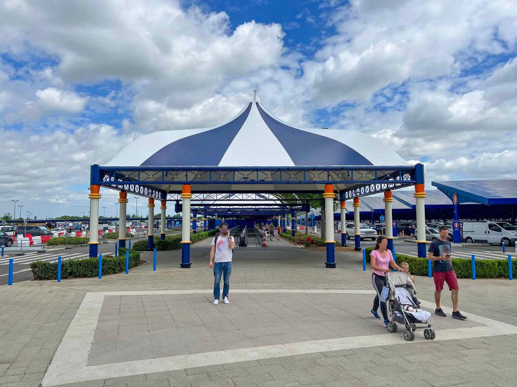 Newly installed tent structures at the main Disneyland Paris guest parking lot. Still under construction in the photo.